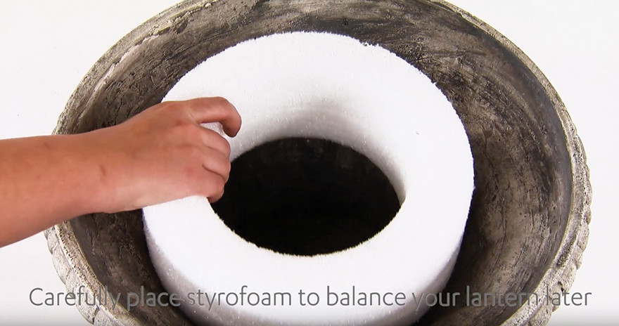 Place styrofoam in planter and balance